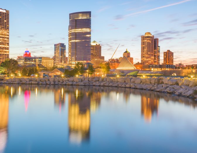 Milwaukee, Wisconsin, USA downtown city skyline on Lake Michigan at twilight.